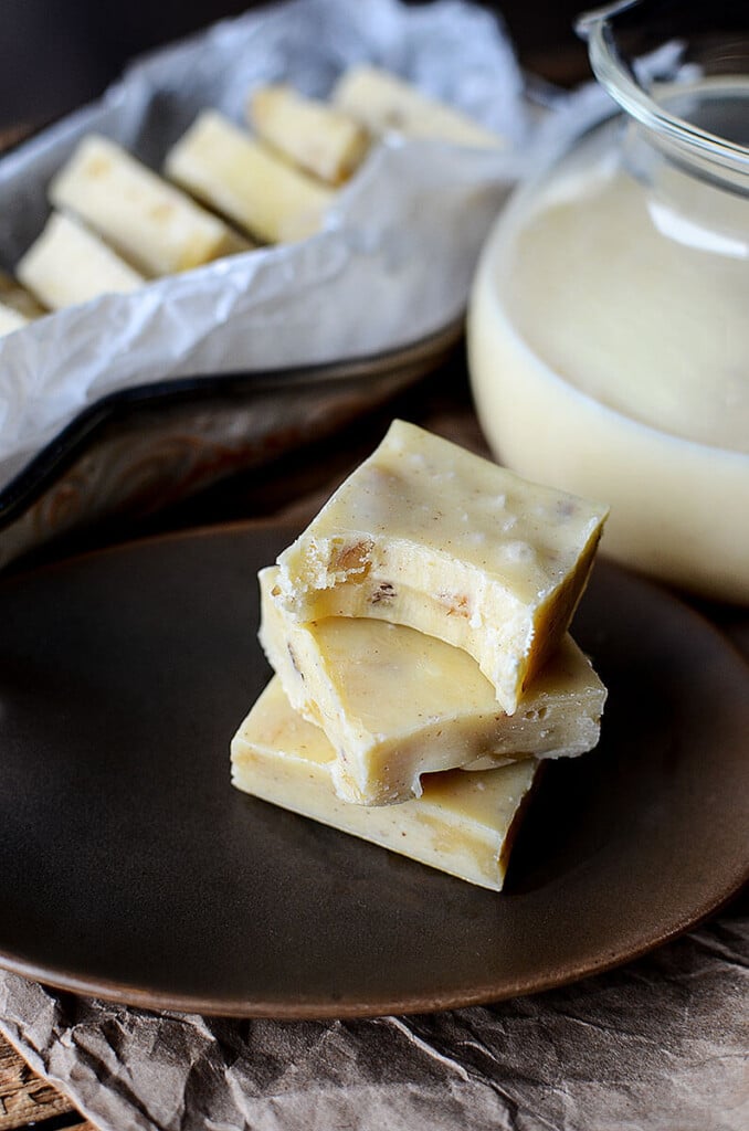 This close up photo of the Eggnog Walnut Fudge piece with a bite taken out of it make a person drool over just how soft and creamy this eggnog fudge can be! 