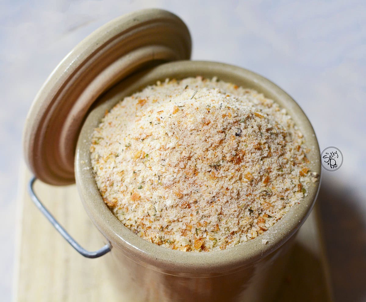 Breadcrumbs in a crock with the lid on the side.