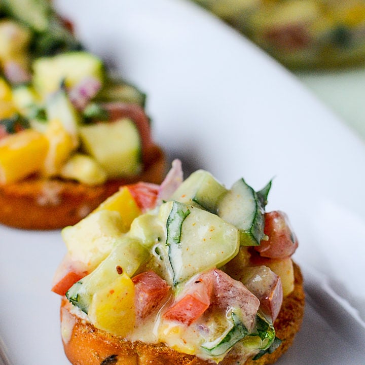 Cucumber avocado salsa on crostinis