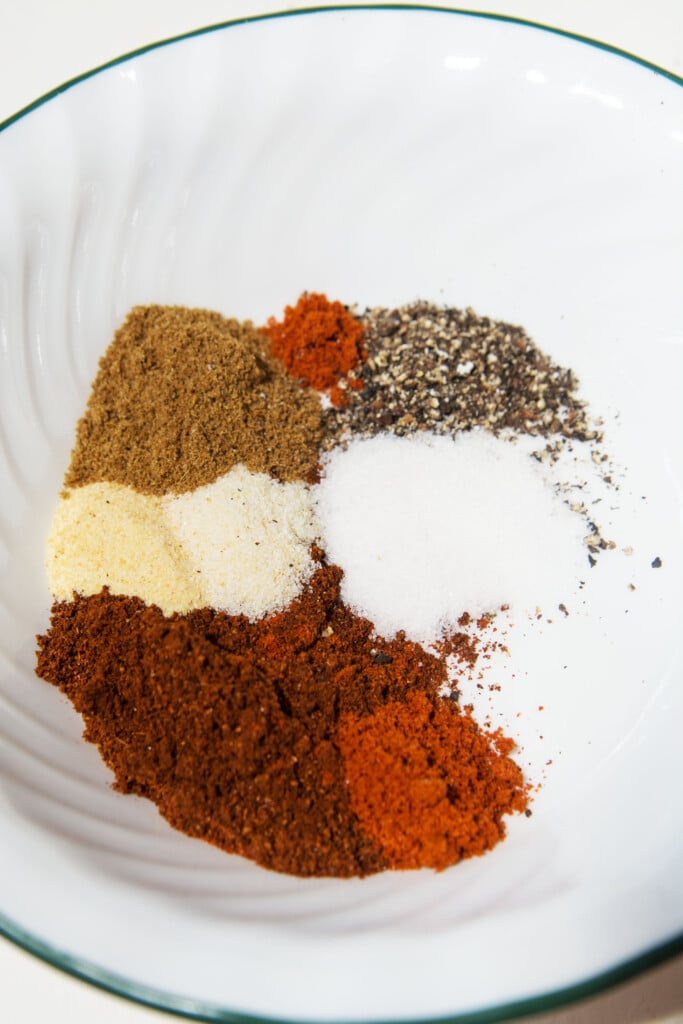 All the spices you need are shown in this photo, separately placed in a white bowl. 