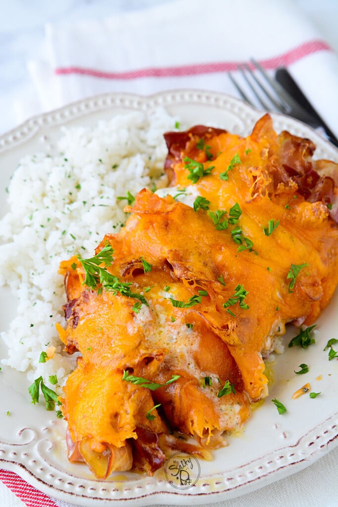 16 cheesy chicken recipes that will knock your socks off. Yummy cheesy chicken flavors that say I'm the picture of comfort food! Tender chicken, crispy bacon pancetta, gooey cheese makes this spectacular!