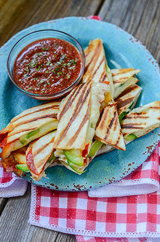 Super ooey gooey cheesy pizza quesadilla sticks! Awesome snack or lunch food! Healthy tortilla pizzas made with a variety of toppings are great for frugal meals as well!