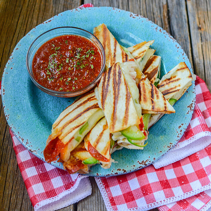 Super ooey gooey cheesy pizza quesadilla sticks! Awesome snack or lunch food! Healthy tortilla pizzas made with a variety of toppings are great for frugal meals as well!
