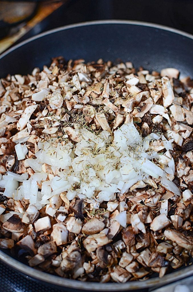 This mushroom soup is all about the flavor. The crucial step that should not be avoided is the one pictured, sauteing the mushrooms, onion and seasonings, to really enhance the mushroom flavor for the creamy mushroom soup!