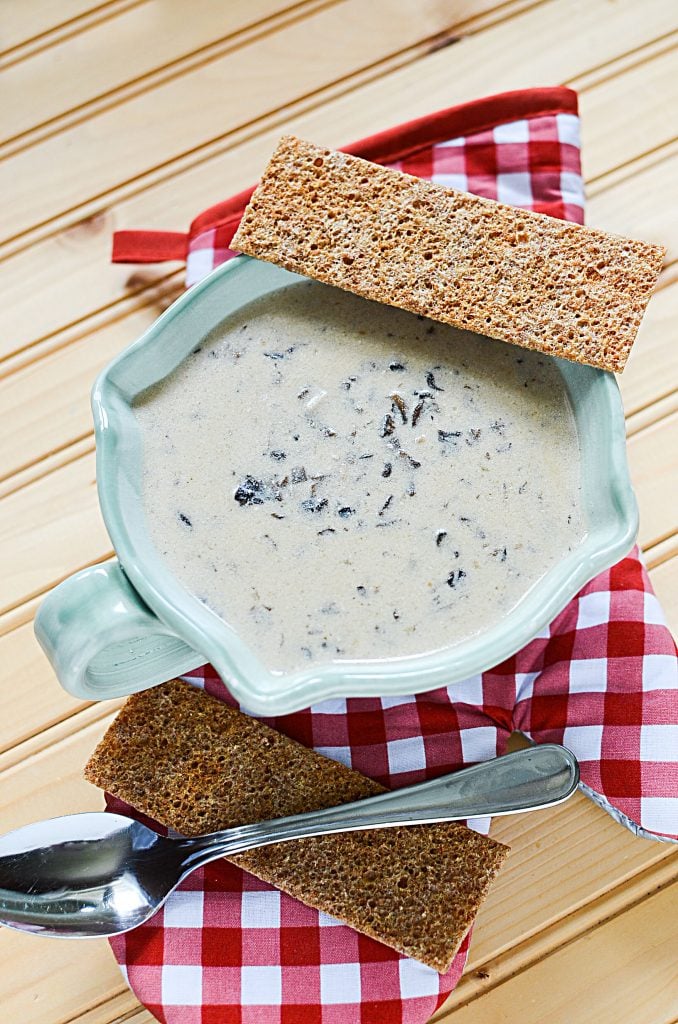 This slow cooker creamy mushroom soup is best served with sides of crackers or crusty bread. The bowl of soup pictured here has to crispy crackers that are perfect for dipping!