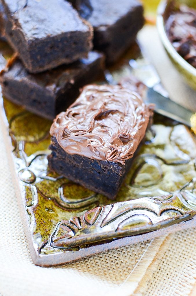 These two ingredient pumpkin brownies will hit all those pumpkin spice and chocolate cravings in one bite!! Just look at them on that plate!