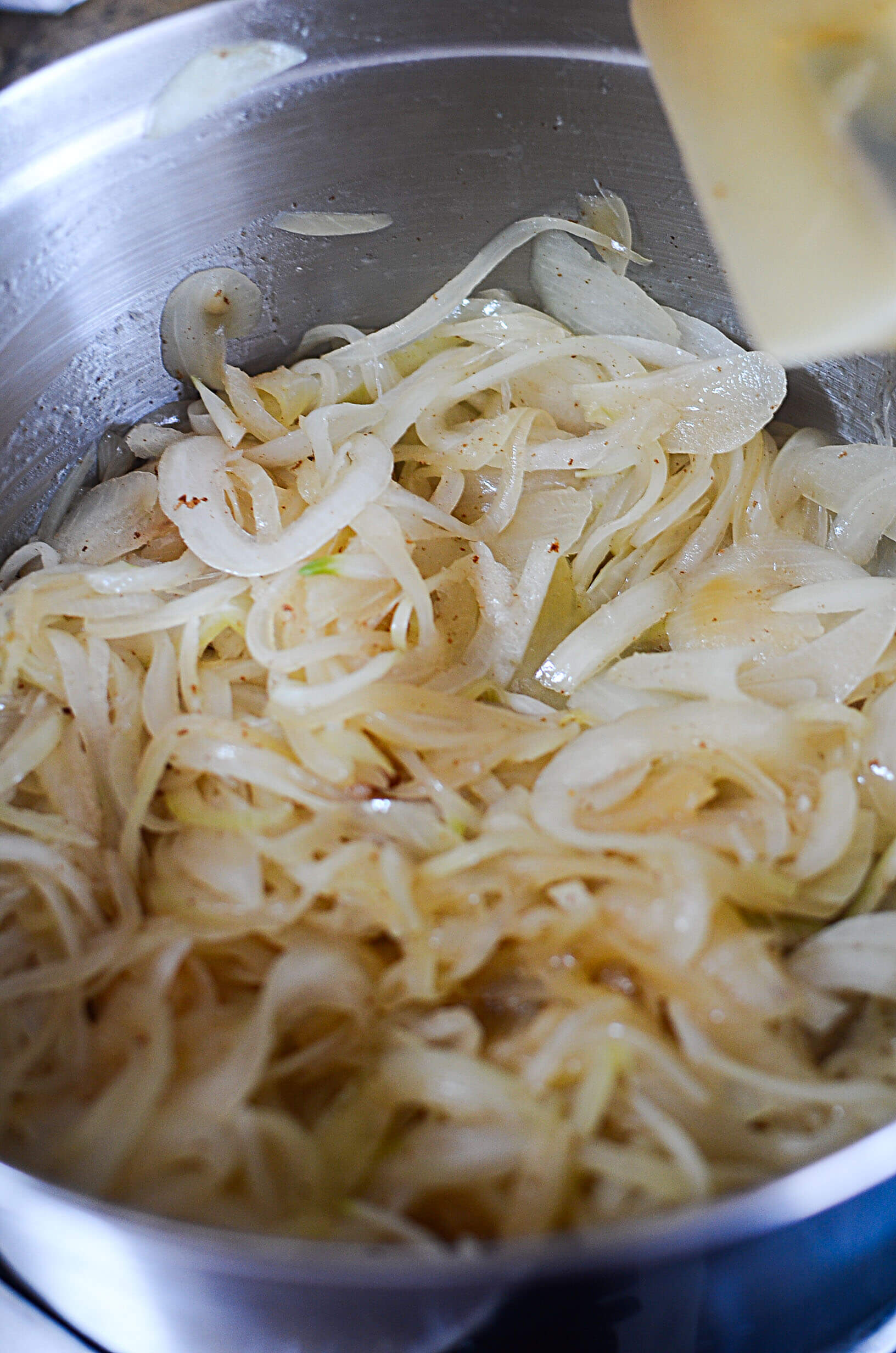 Onions beginning to get some color through caramelization. 