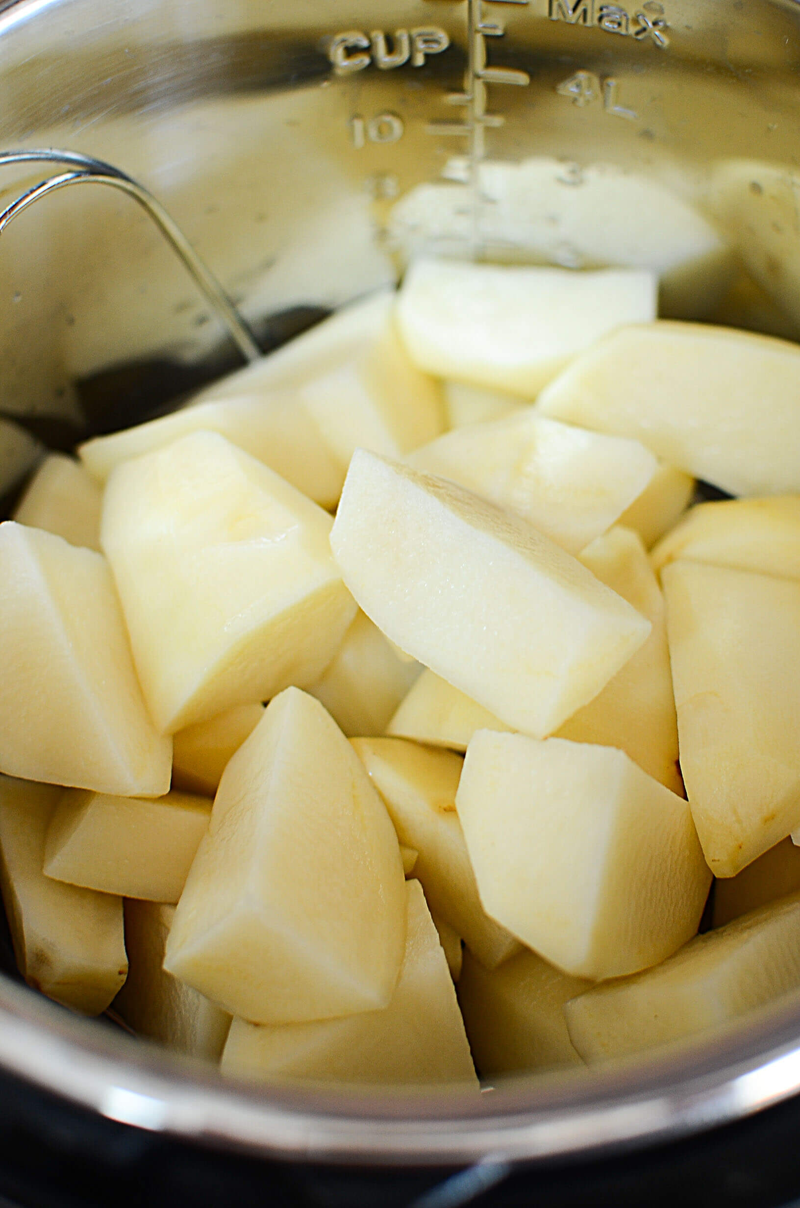Peeled and cut potatoes in the instant pot. 
