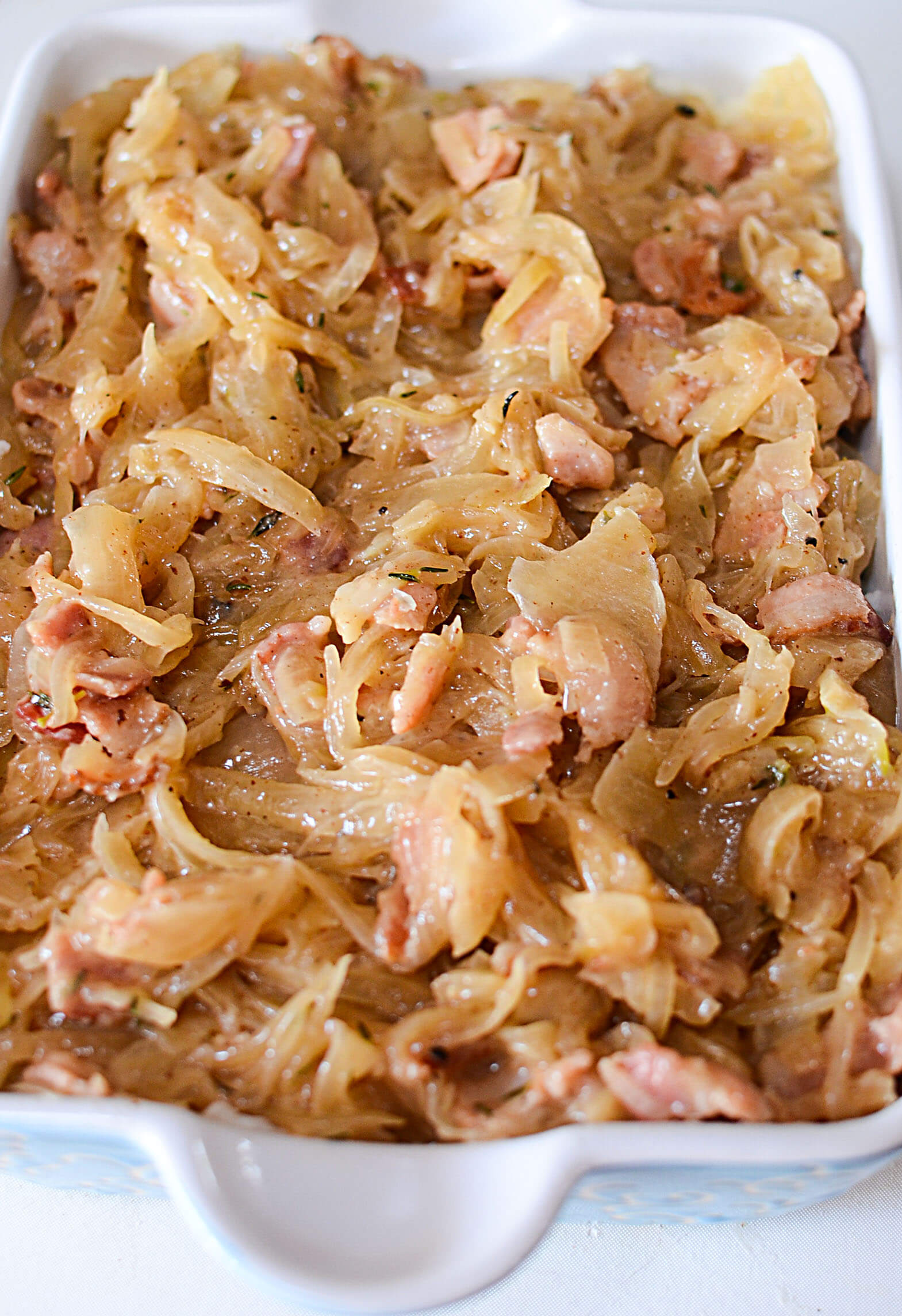 The bacon and onion mixture placed on top of the potatoes. 