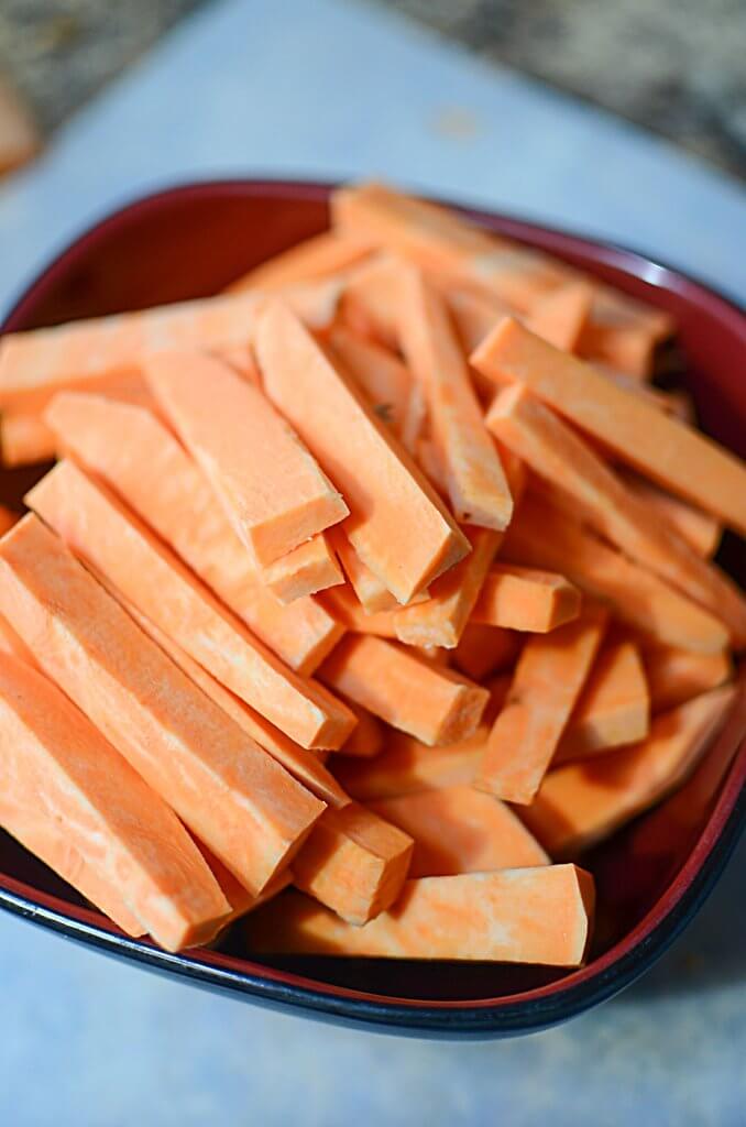 Trying to get your kidlets to eat more veggies??  SOLUTION: Sweet potato fries. Not just ANY sweet potato fries - Honey Butter Cinnamon Sweet Potato Fries!!