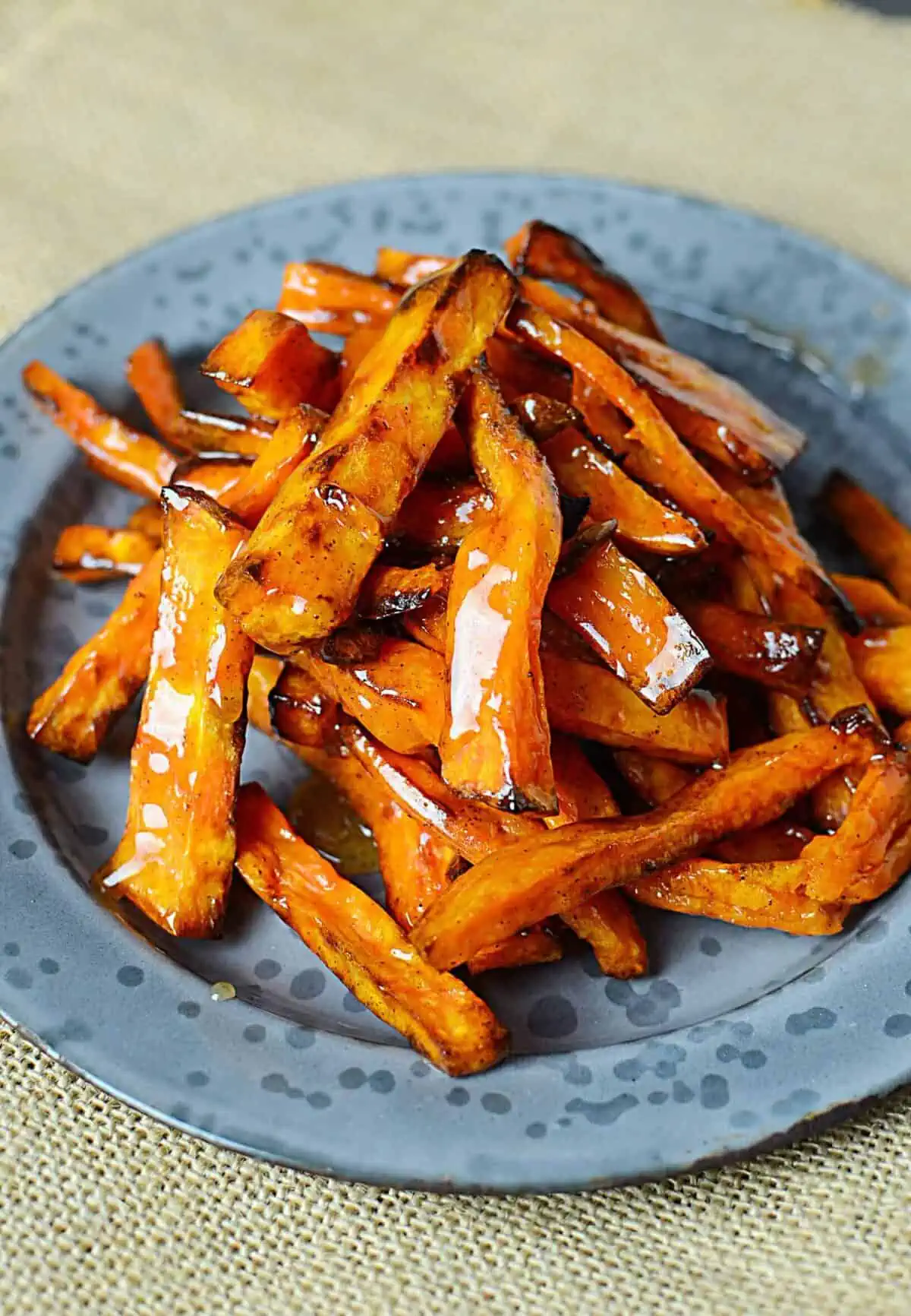 Air fryer honey butter Sweet potato fries on a grey plate.