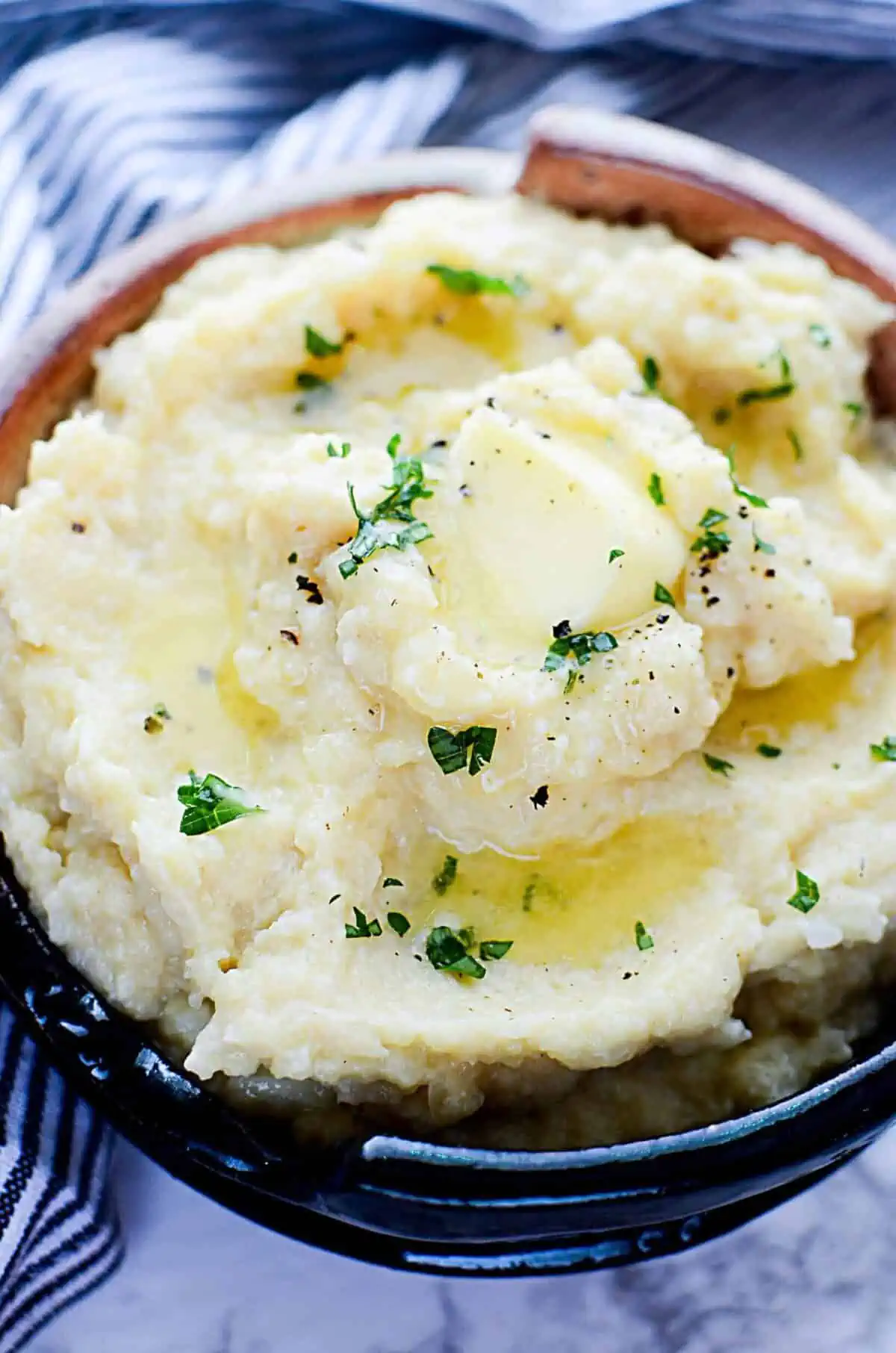 Cauliflower mashed potatoes in a pottery bowl.