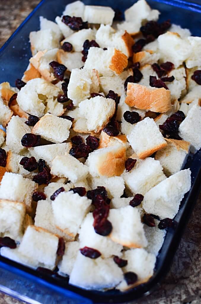 Warm,comforting Eggnog Bread Pudding with Cranberries is a perfect way to start Christmas morning! Best of all, make it the night before & bake in the A.M.! - The Salty Pot
