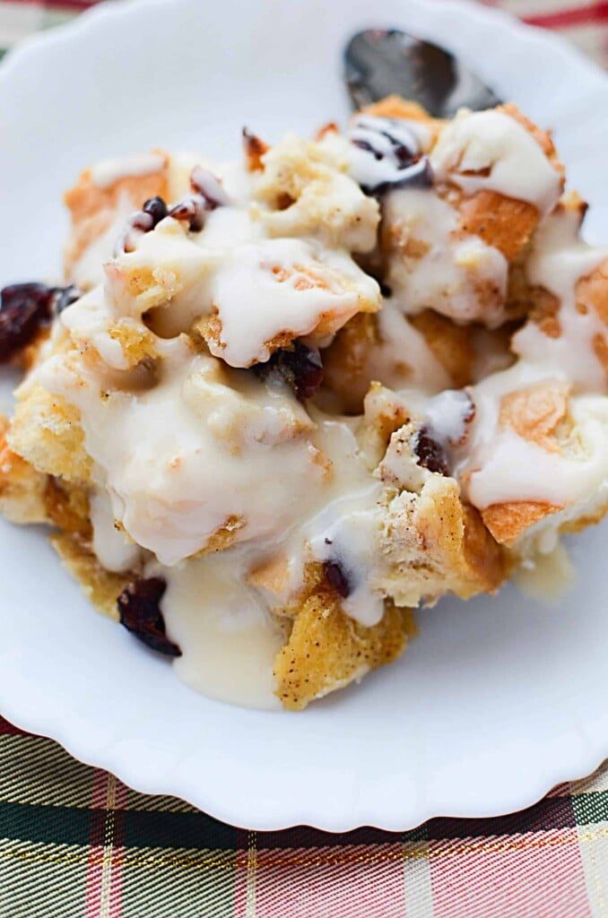 Warm,comforting Eggnog Bread Pudding with Cranberries is a perfect way to start Christmas morning! Best of all, make it the night before & bake in the A.M.! - The Salty Pot