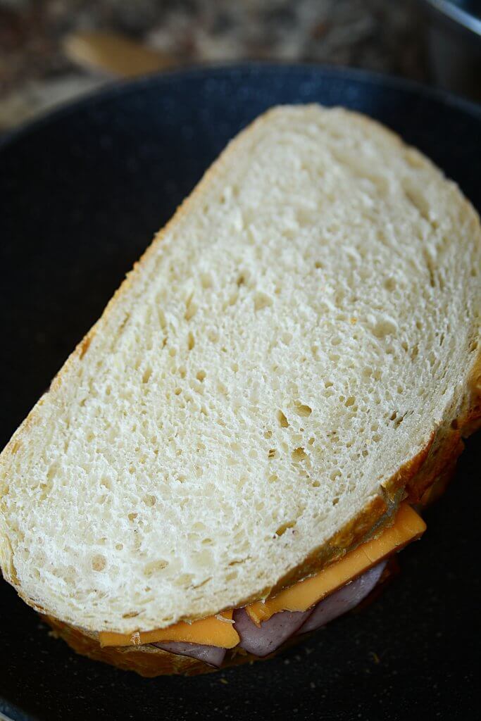 The sandwich assembled and ready to grill in the frying pan.