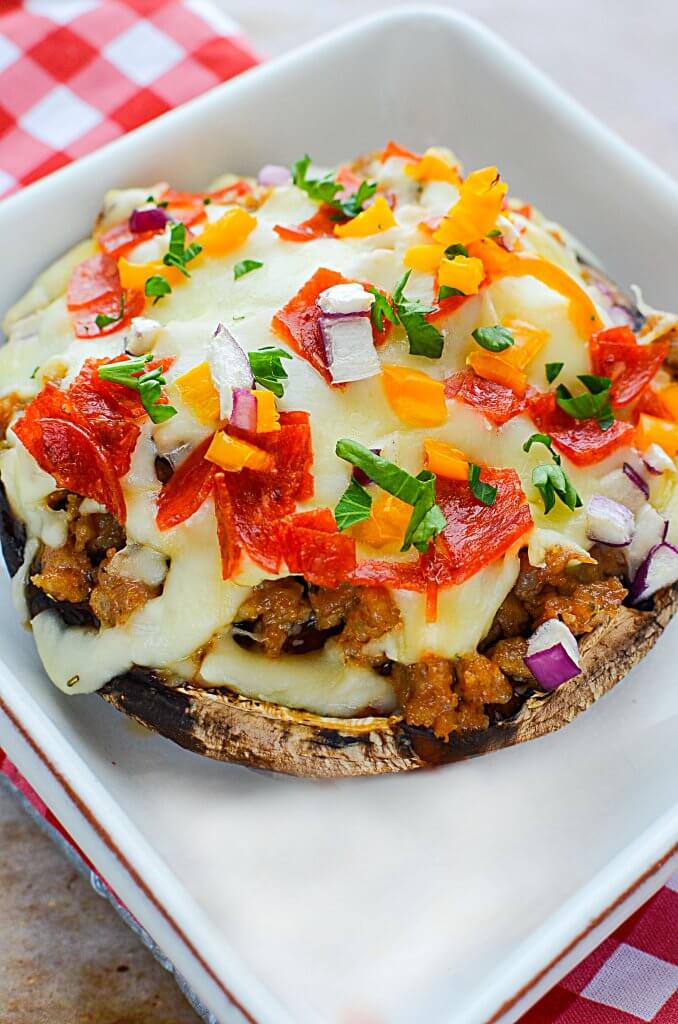 The savory sausage, the juiciness of the mushroom with zesty tomato sauce & the gooey cheese make this Sausage Stuffed Portobello Pizza Recipe AMAZING!!! - The Salty Pot