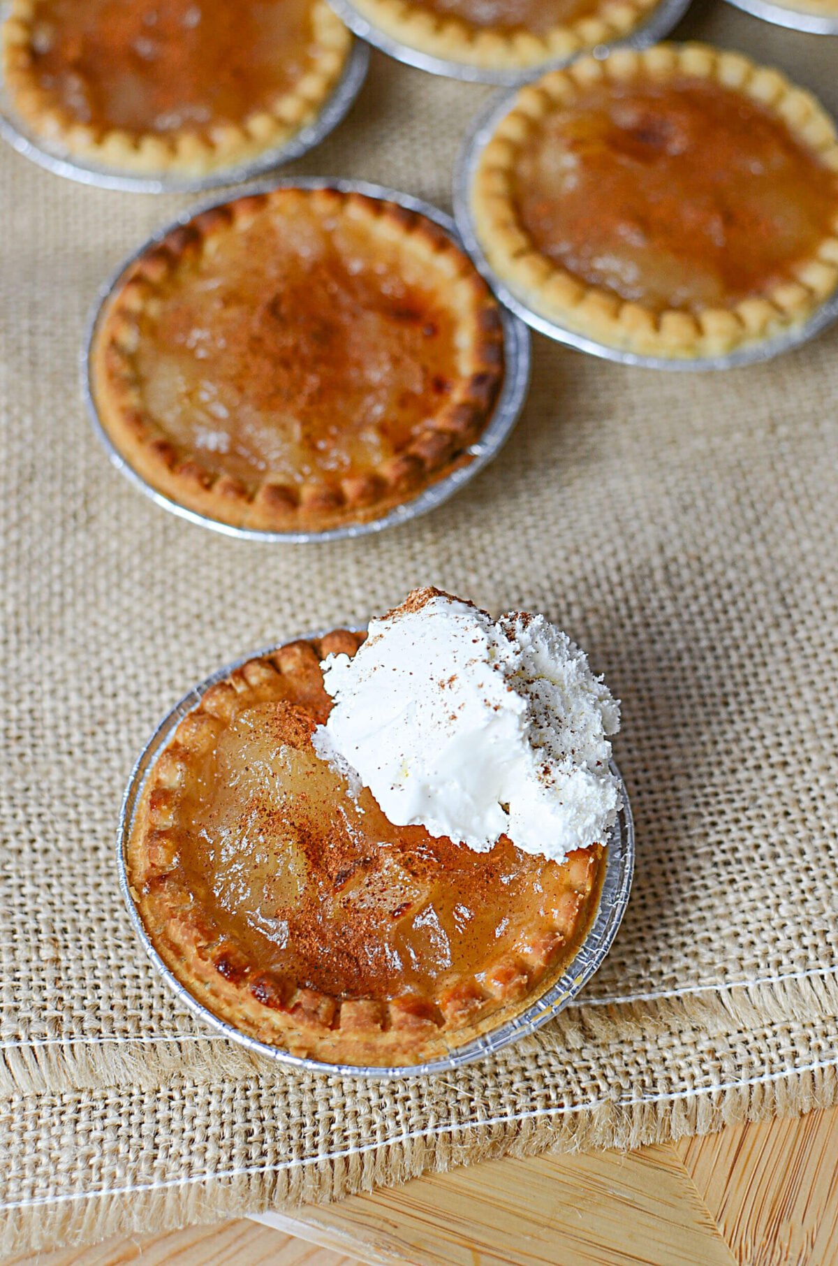 Apple tarts on a burlap napkin.