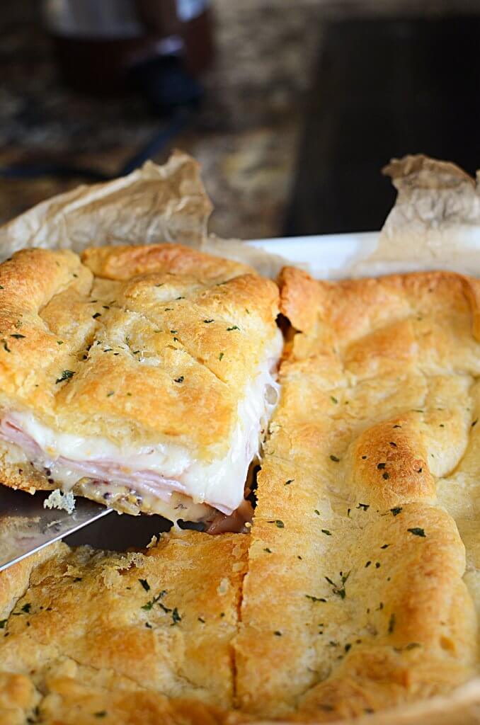 These are the easiest hot ham and cheese sandwiches you'll ever make for dinner! These aren't your typical loaf of bread ham and cheese sandwich! Check them out! - The Salty Pot