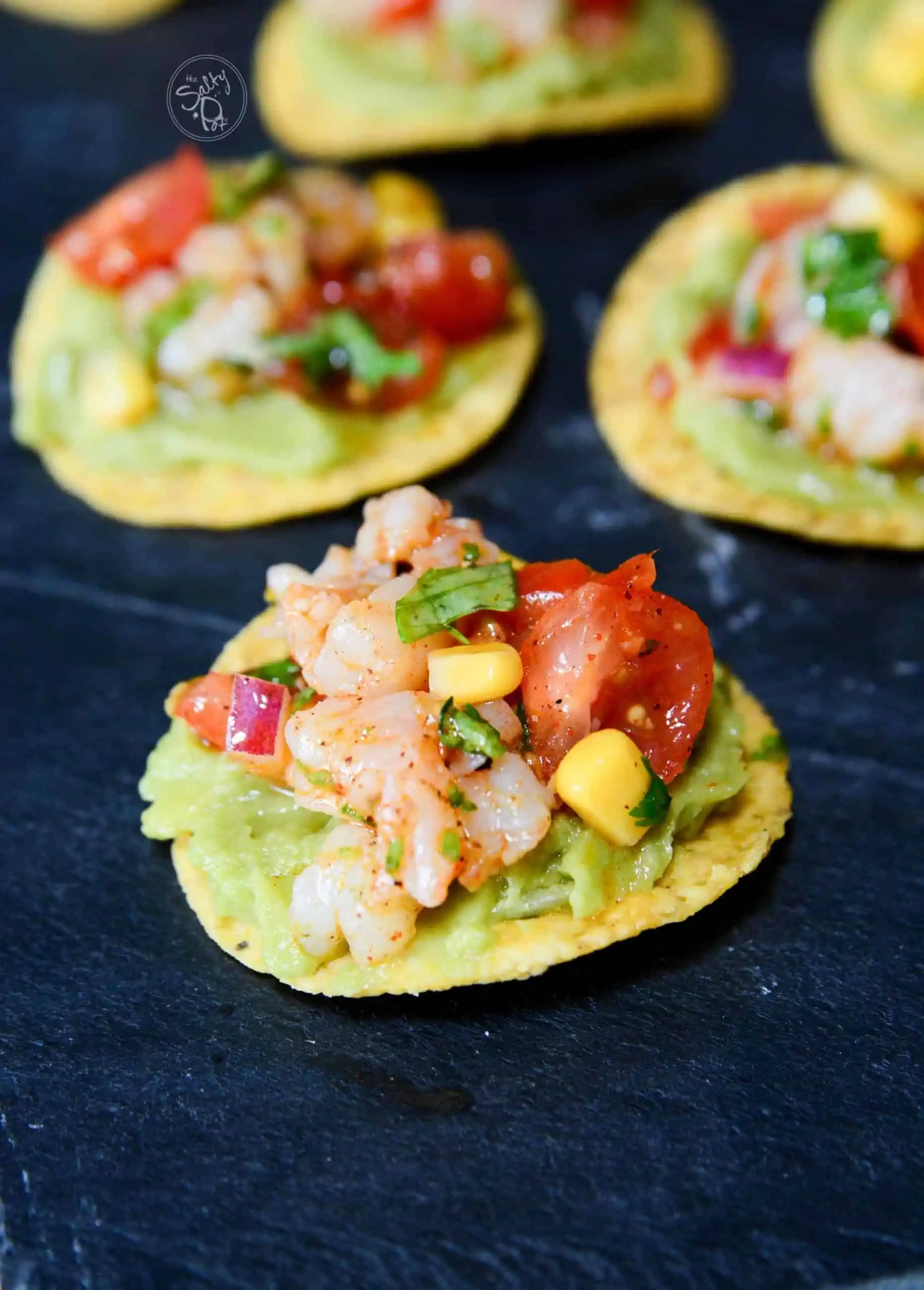 A shrimp appetizer on a blue napkin.