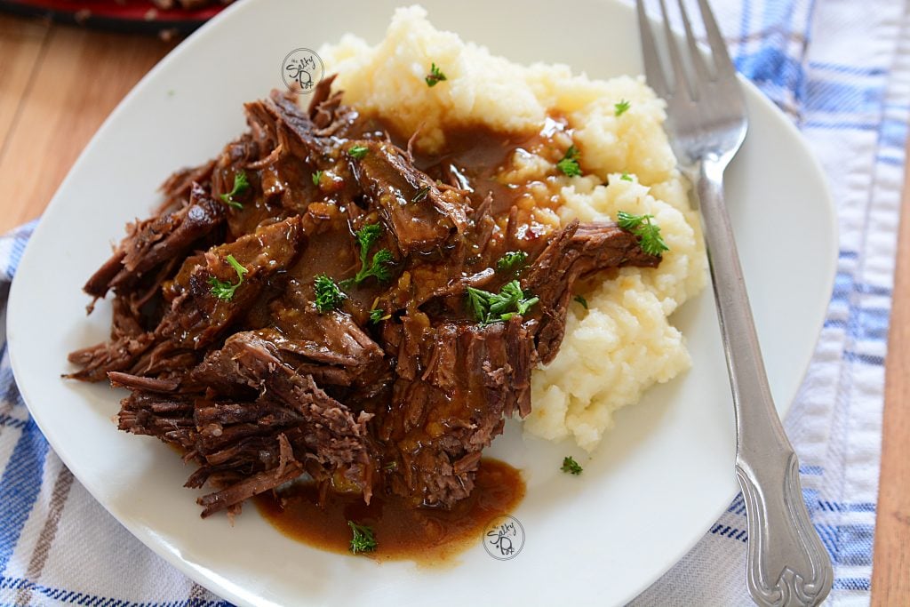 Instant pot 3 packet roast. Yummy, beef roast morsels with a rich beefy gravy, all over creamy mashed potatoes!