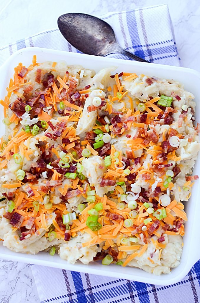 Yummy Instant Pot Loaded Mashed Potatoes - Casserole dish with loaded potatoes