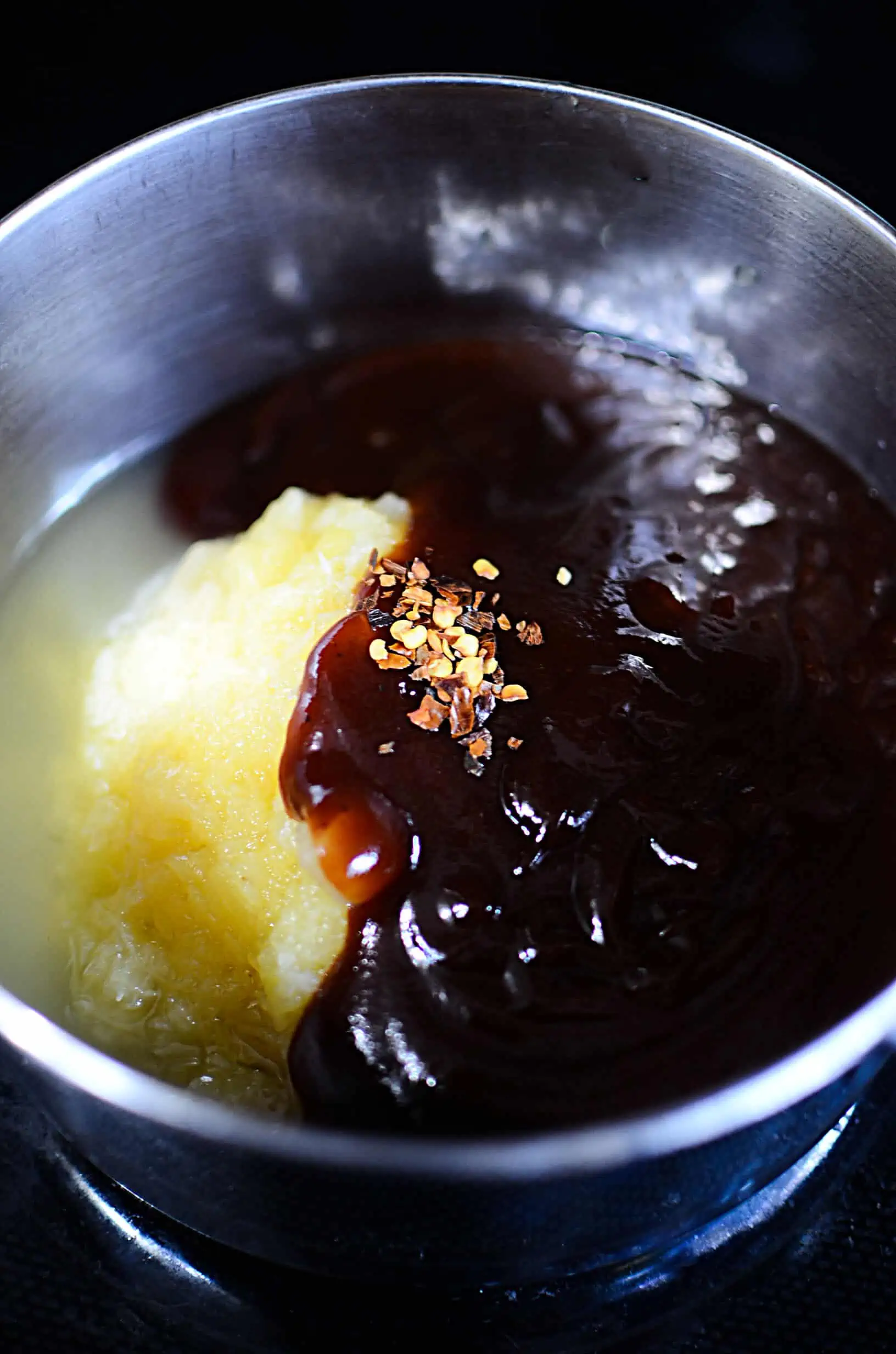 Ingredients for basting the ribs in a silver bowl.