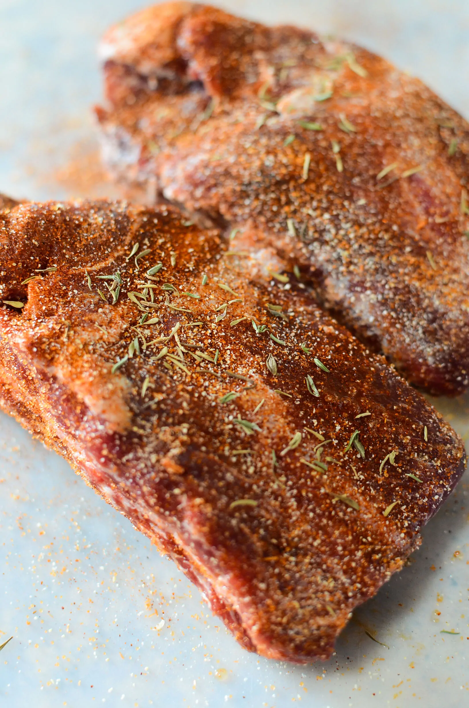 Two short ribs, seasoned.