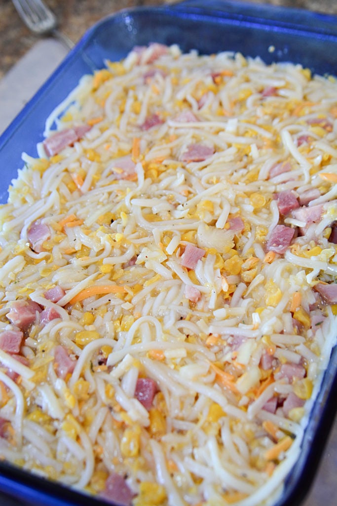 You can see the bits of ham, cheese and corn mixed up to make this hashbrown casserole