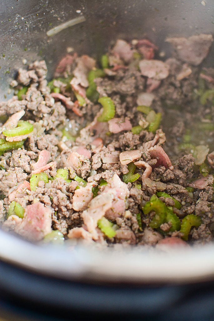 sauted ground beef, celery, onions and bacon in the pressure cooker