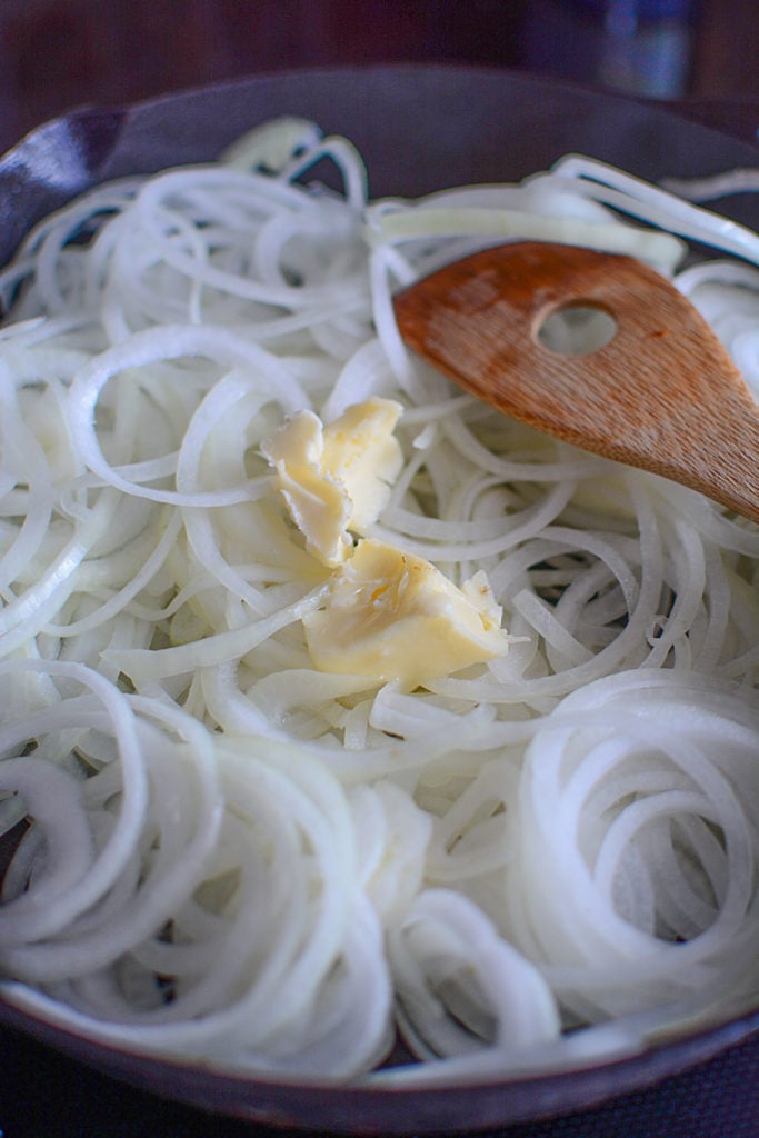 Starting the caramelization process with the onions and butter in the pan.