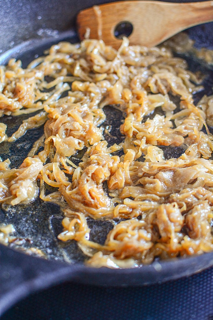 The onions are caramelizing in the cast iron pan.