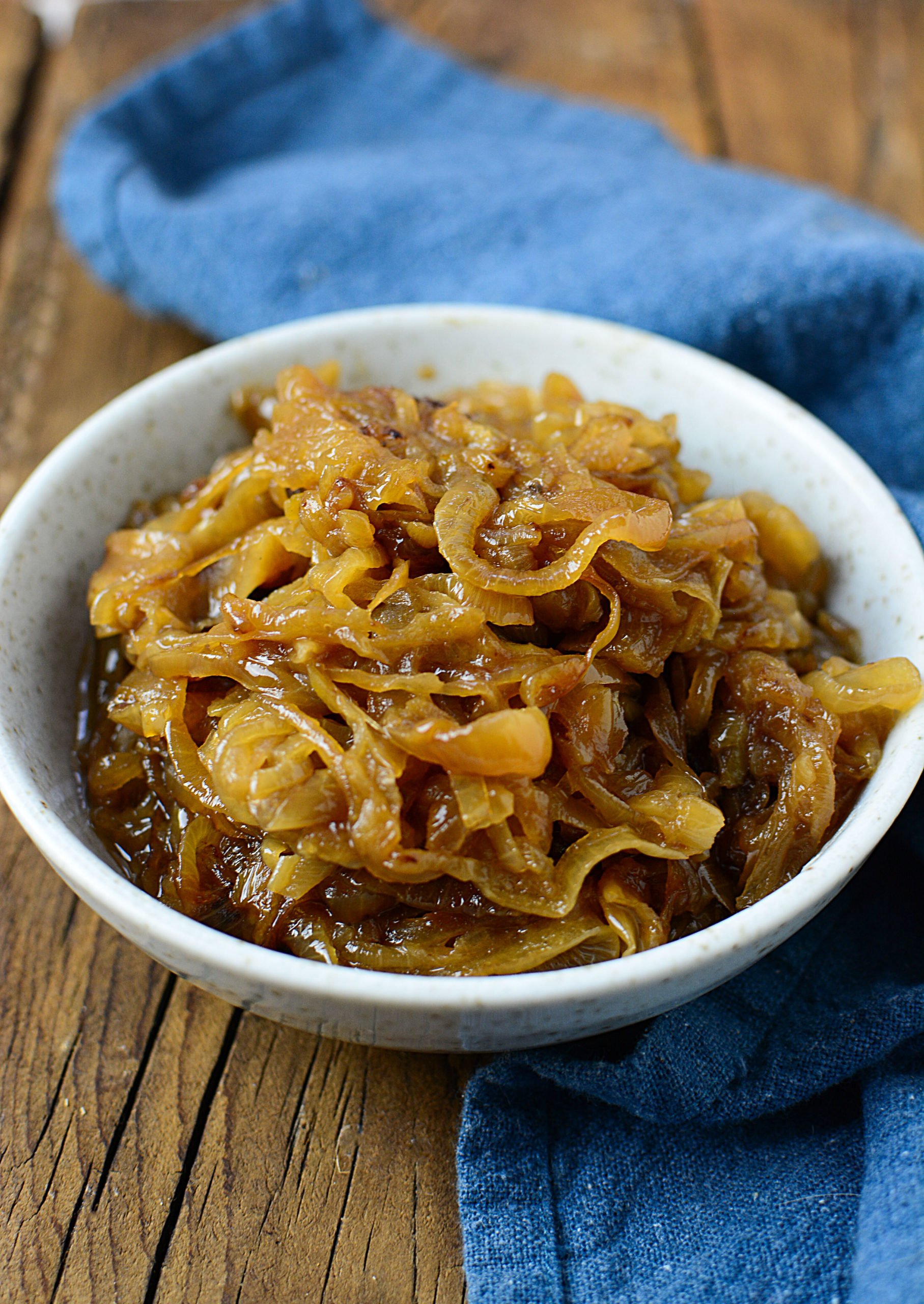 Caramelized onions in a speckled cream color bowl.