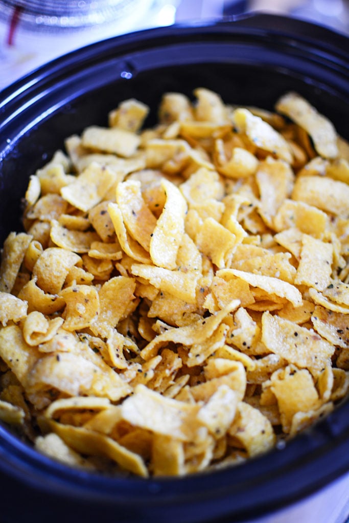 Chips topped with seasonings in a large blue bowl