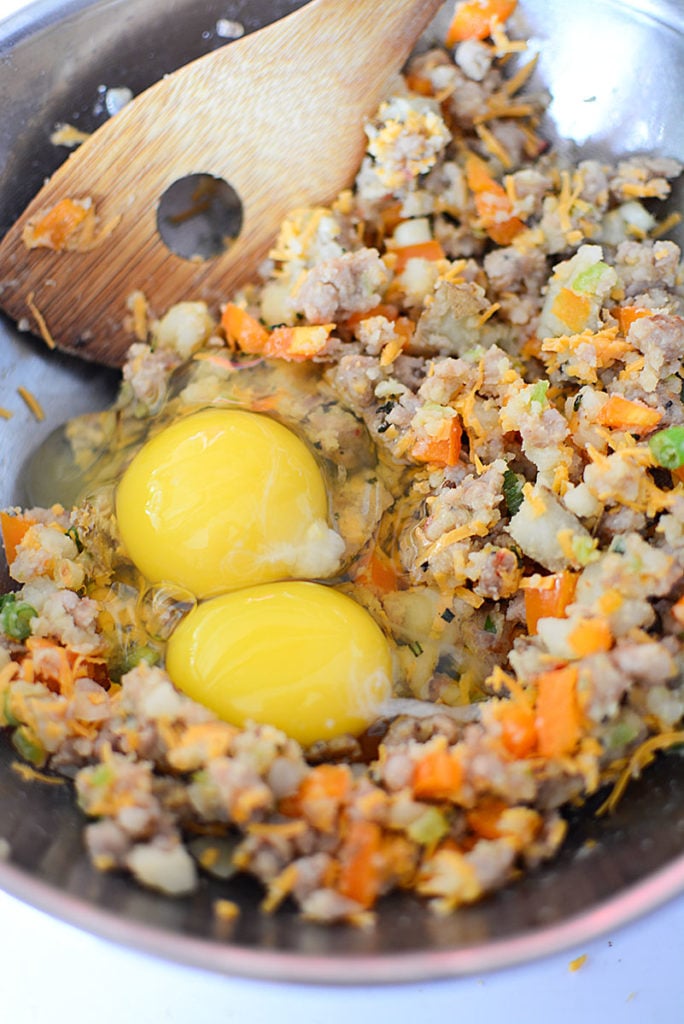 A bowl with two eggs and other ingredients