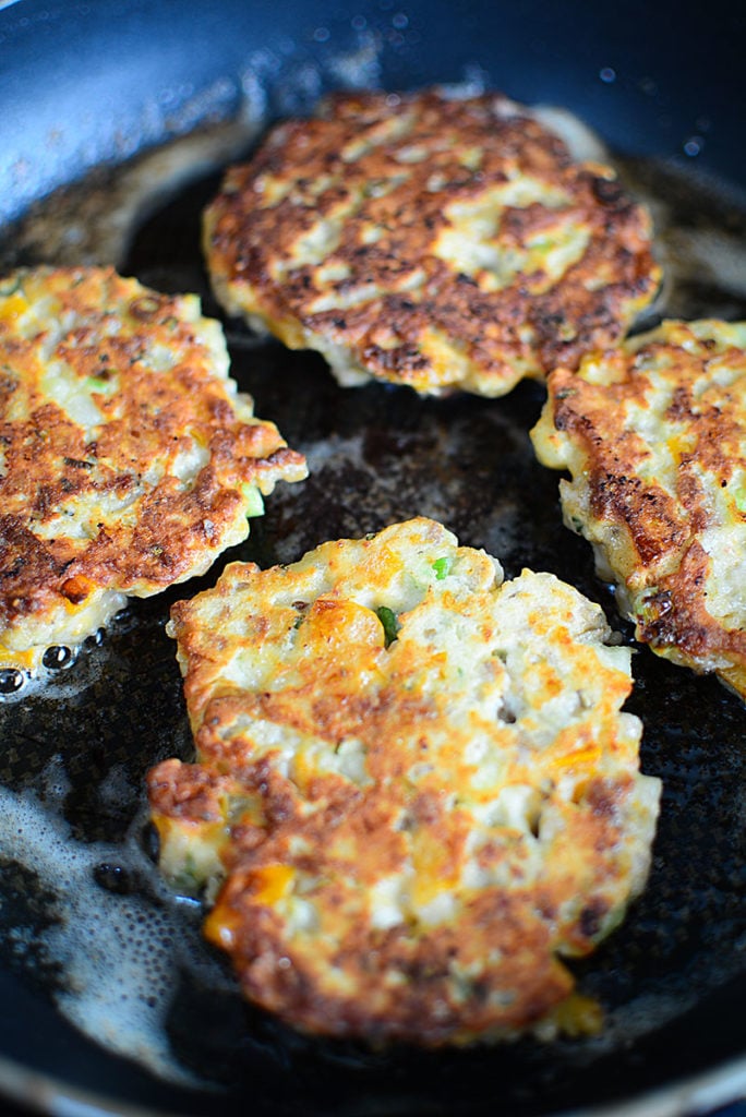 These potato patties are frying on the other side, with the side up showing a nice crispy crust