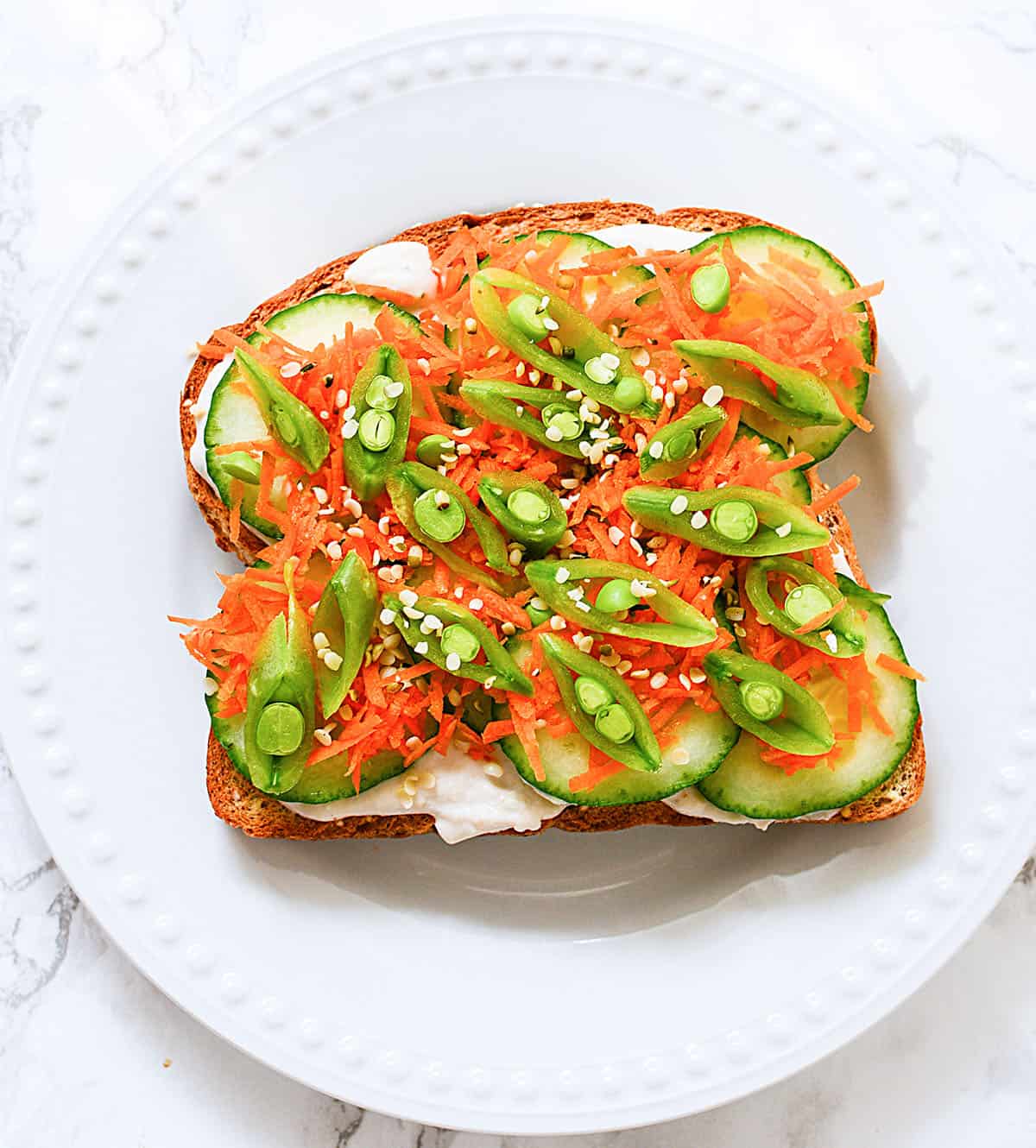 Veggies with hummus on toast.