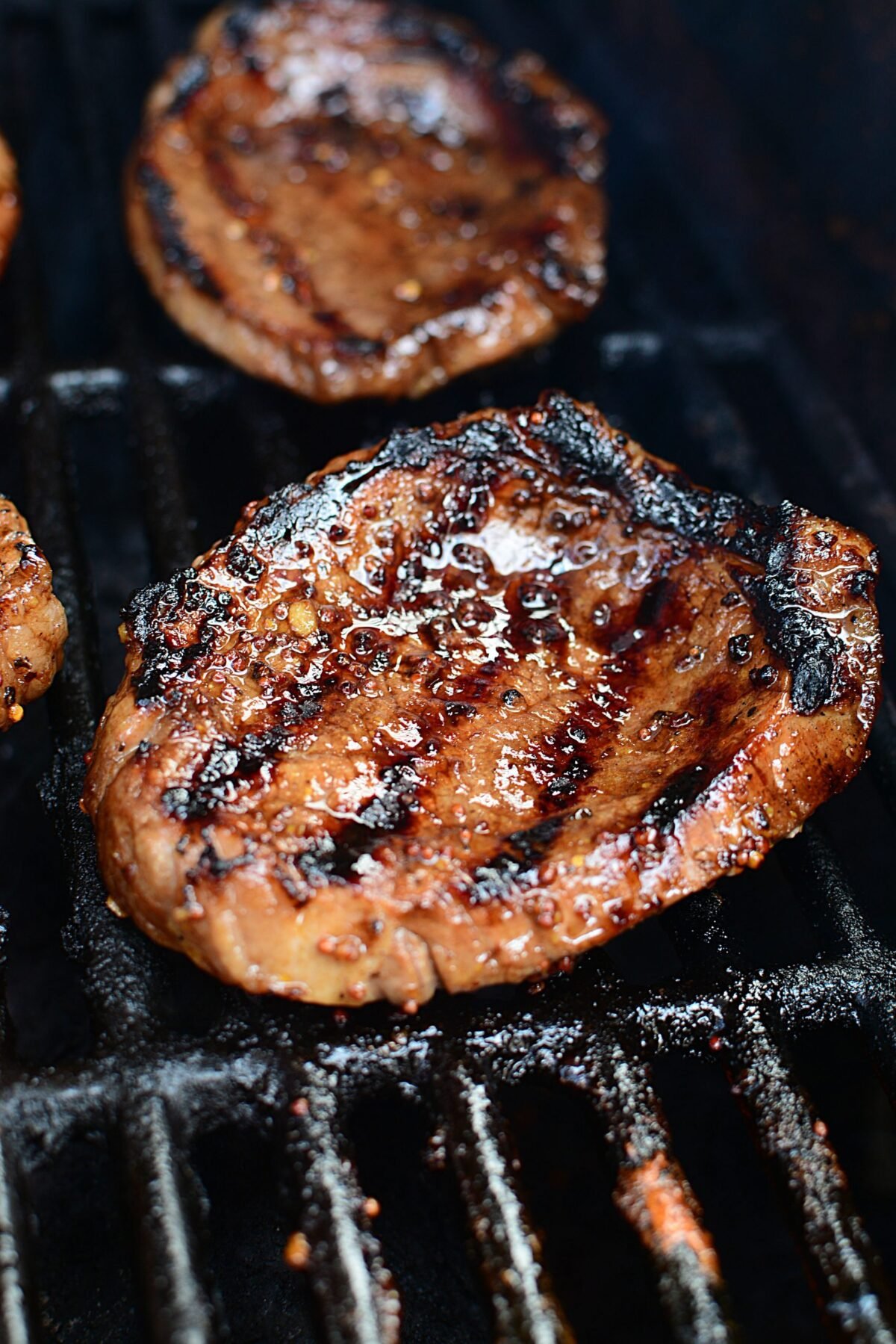 A grilled steak on the barbeque.