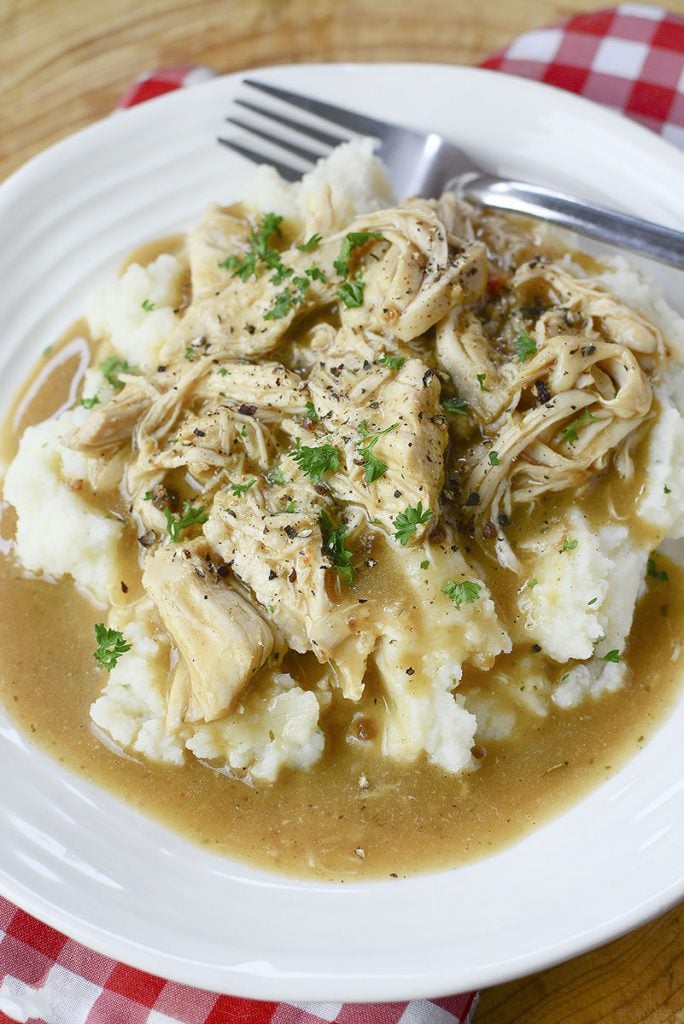 Chicken and potatoes in gravy.