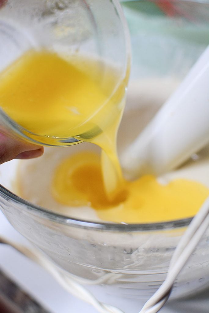 Adding melted butter to the waffle batter to add that luxurious flavor to the homemade waffles.