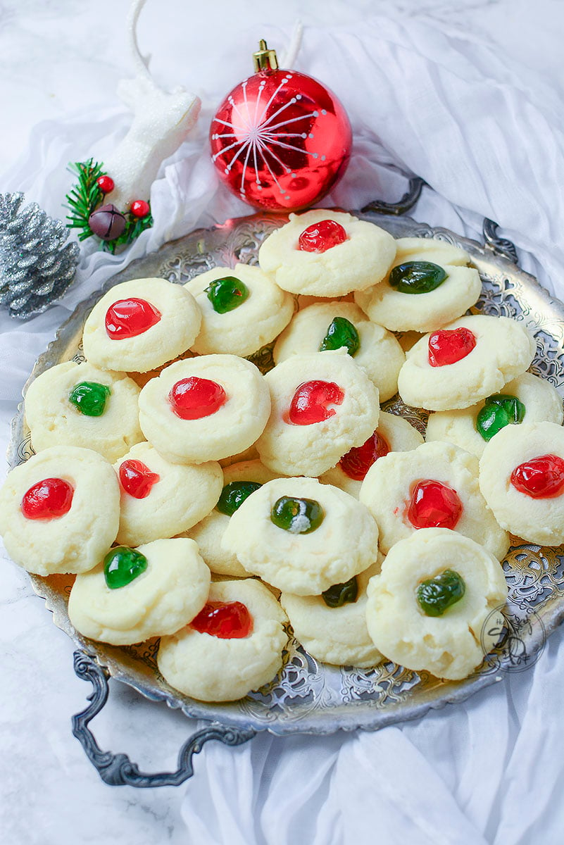 These delicious whipped shortbread cookies look so pretty served on a silver platter with little christmas decorations around them!