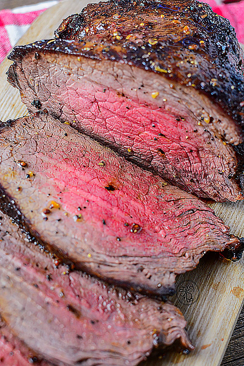 A well rested roast of any sort will reward you in juiciness after it's sliced like this one on the wooden board.