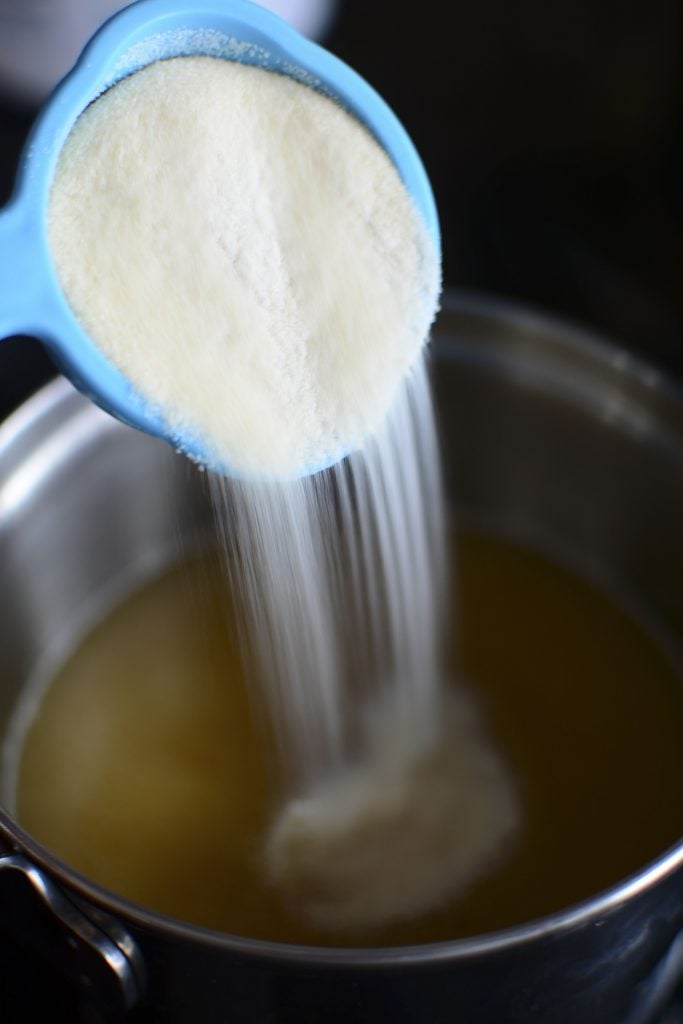 Pouring in the gelatin powder. The powder is what makes gummies - gummies!