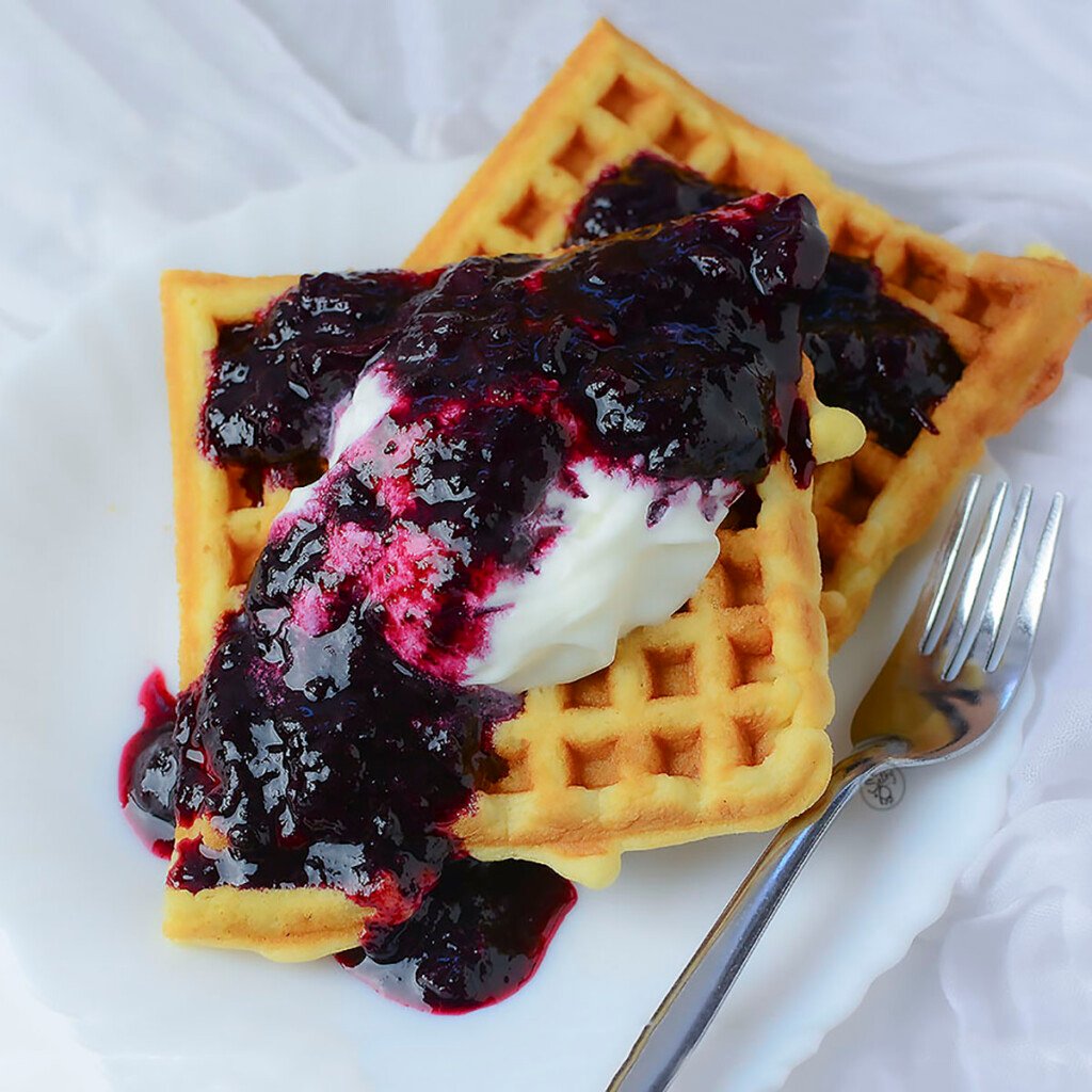 Waffles with blueberry sauce and creme fresh.