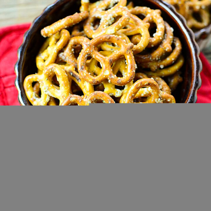 pretzels in a bowl spilling out onto a red napkin.