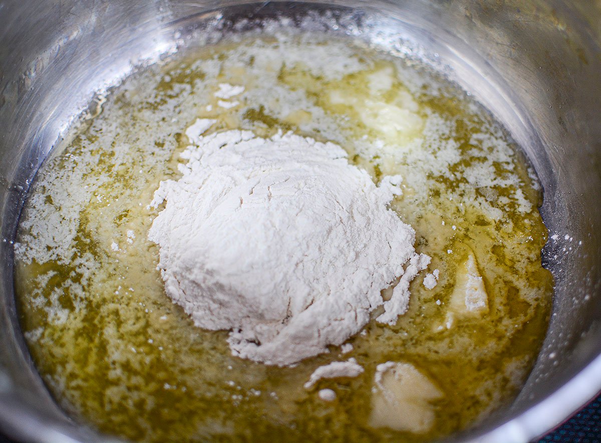 Flour about to be whisked into the melted butter.