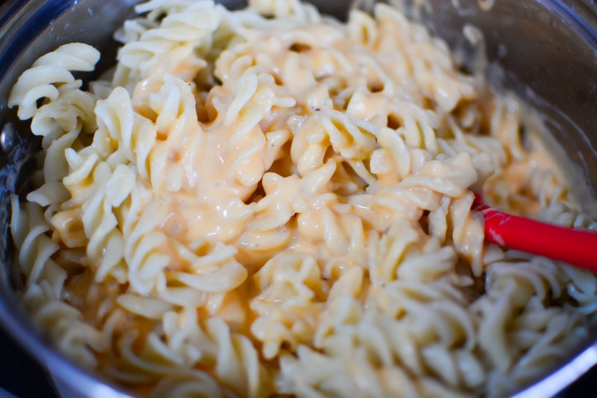 A close up of the rotini pasta with the cheese sauce. 