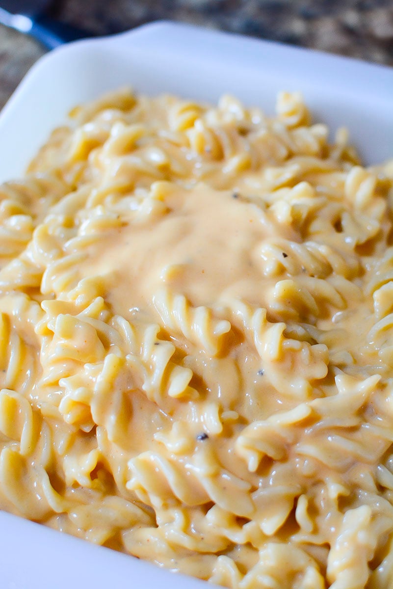 Macaroni and cheese in a white baking dish.