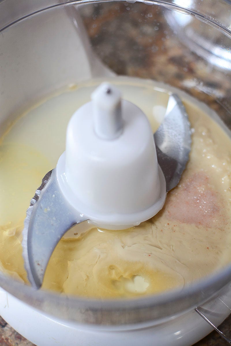 Tahini, garlic and salt in the food processor.