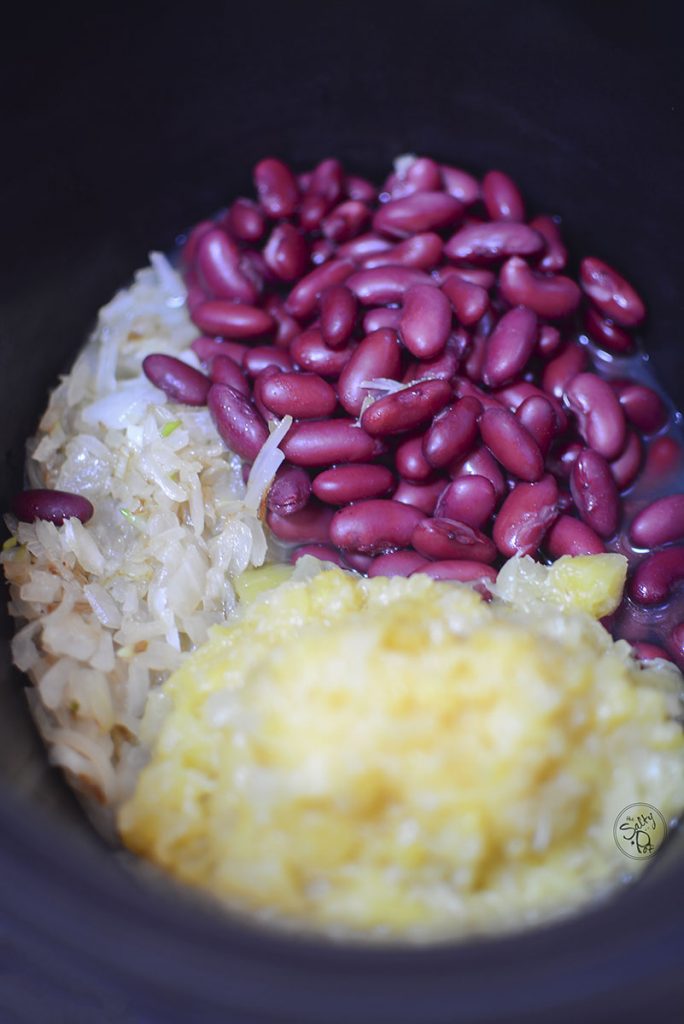 Kidney beans, pineapple and onions in the slow cooker.