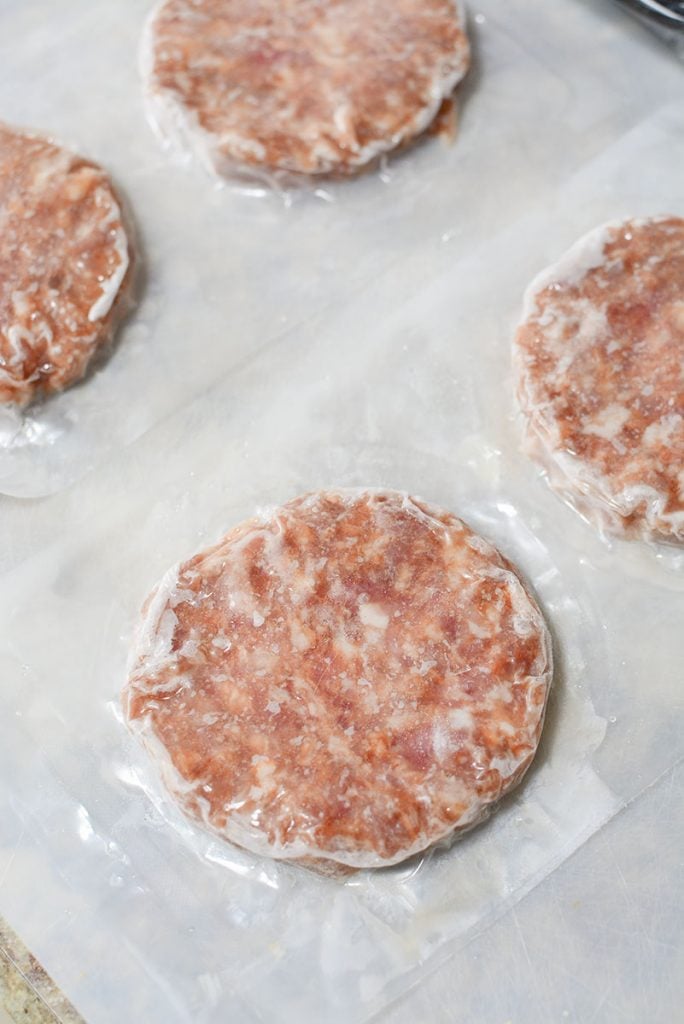 Four frozen sausage patties.